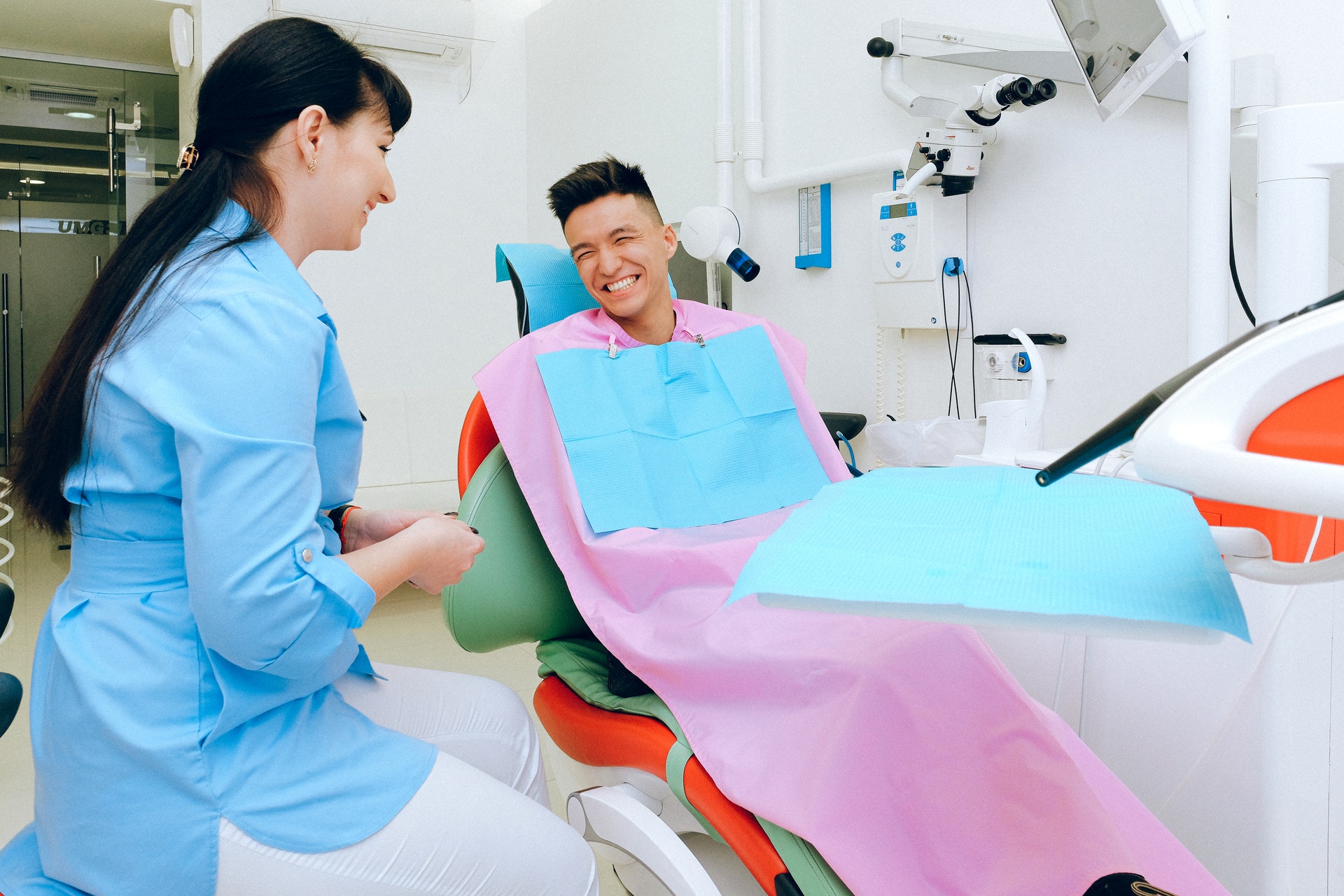 Teen boy talking to a specialist about Invisalign