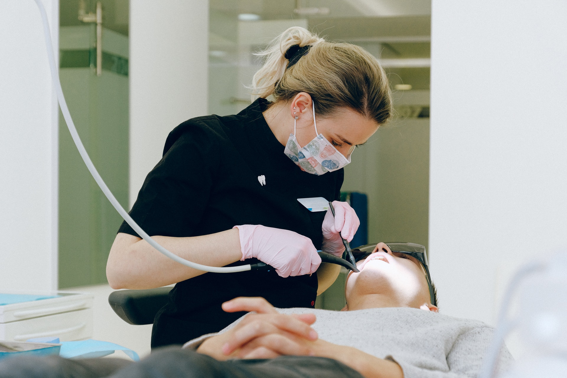 Man getting wisdom teeth inspected by a dentist