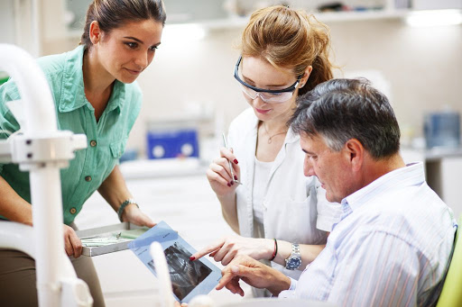 dental consult looking at x-ray trying to diagnose mouth pain which could be a dental abscess