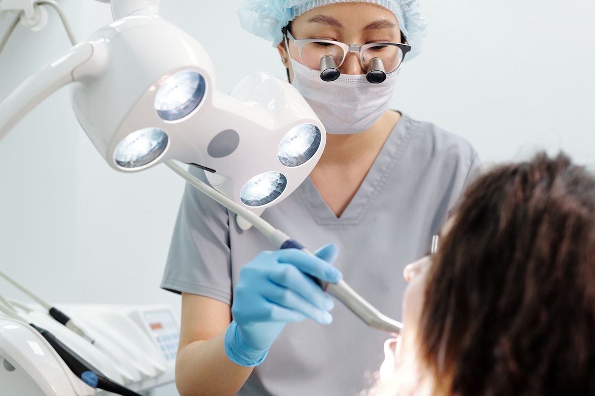 Getting a dental cleaning to prevent costly treatment without insurance