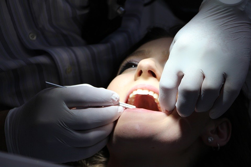 woman getting teeth repaired tooth filled