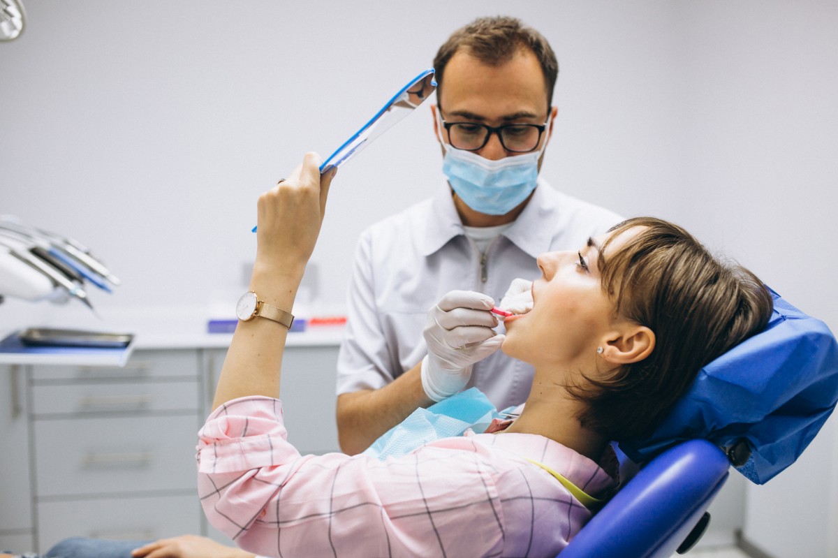 woman having teeth whitened professionally